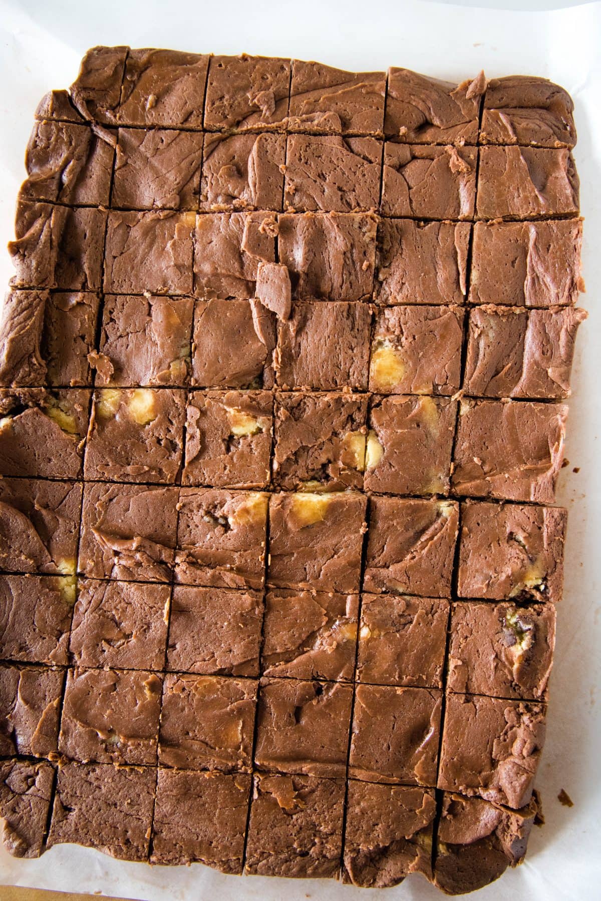 chocolate cookie dough fudge set up and cut into squares