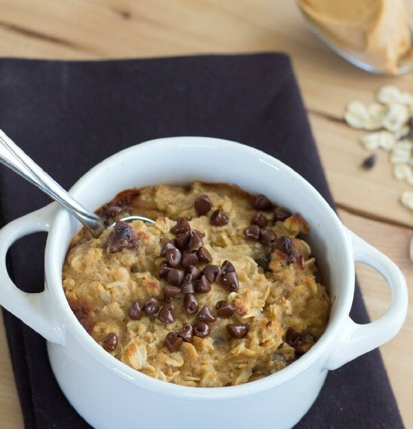 close up cookie dough baked oatmeal in a white bowl