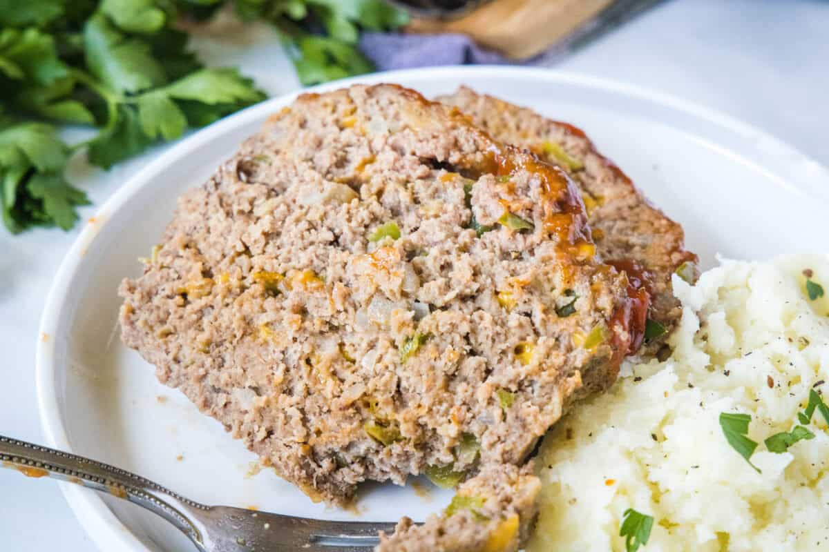 This Cracker Barrel Meatloaf Recipe is a classic comfort food favorite! Made with juicy ground beef, buttery Ritz crackers, and a tangy ketchup topping, it’s tender, flavorful, and just like the restaurant version.