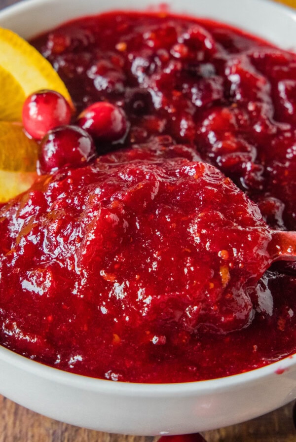 cropped close up of spooning cranberry sauce from a bowl