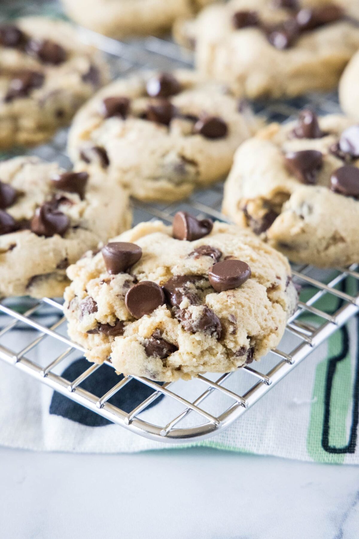 Close up of chocolate chip cookies on a wire rack