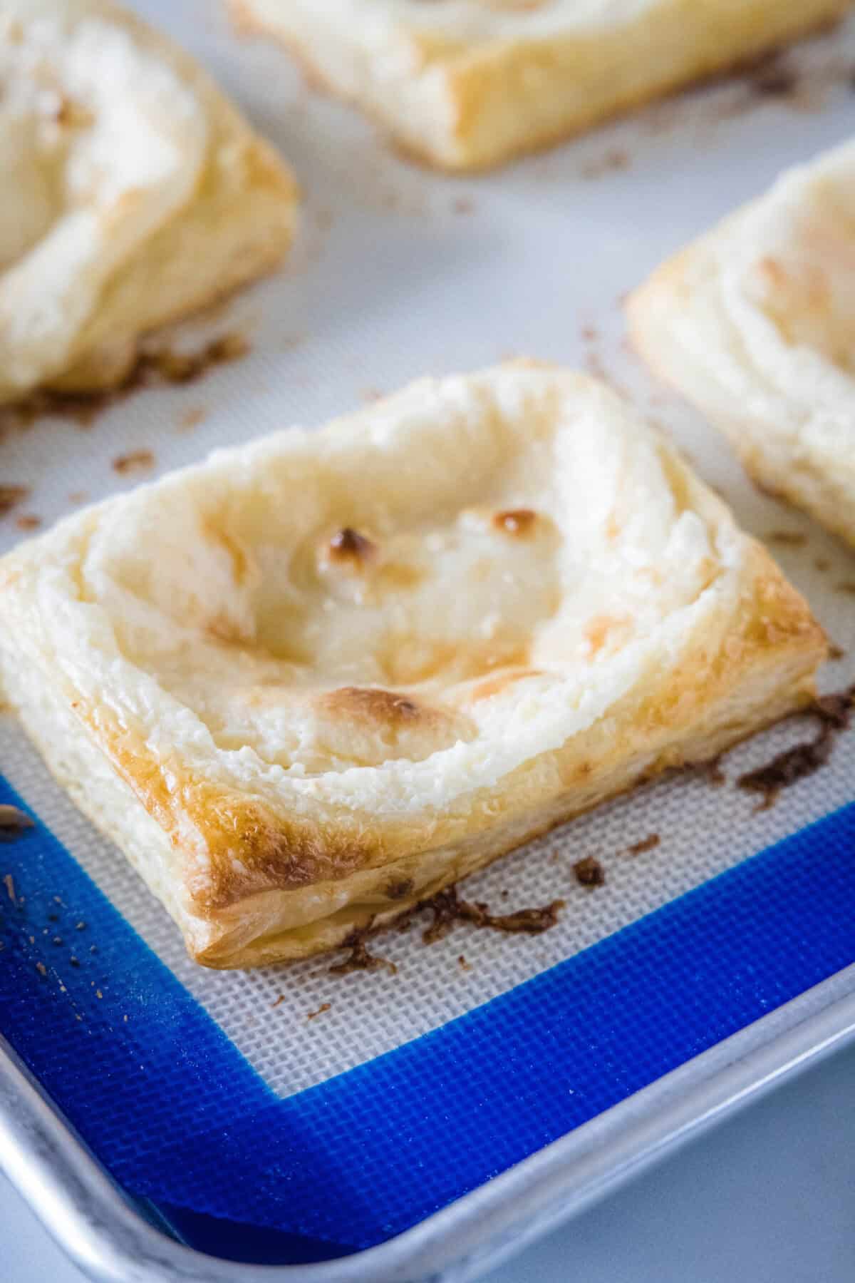 cream cheese danishes on baking tray
