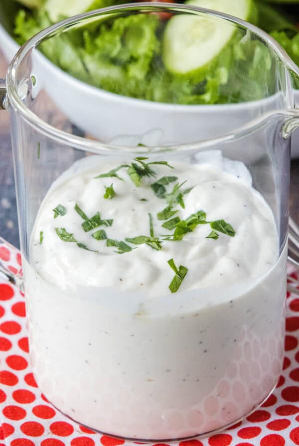 cropped close up creamy garlic dressing in a jar
