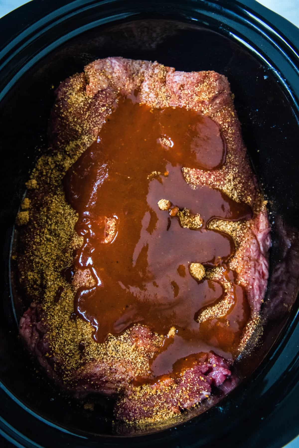 adding brisket to crockpot