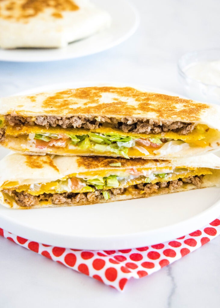 crunchwrap cut in half on a plate