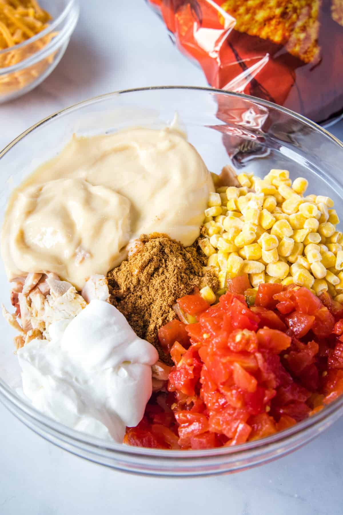 dorito chicken casserole filling mixture ingredients in a bowl