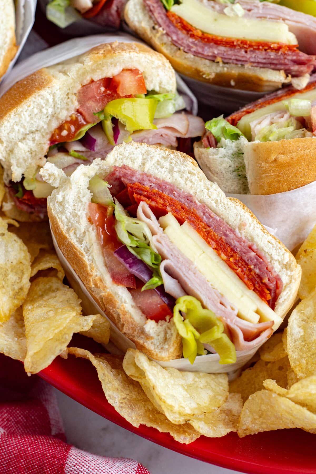 close up italian sub cut in half on a platter