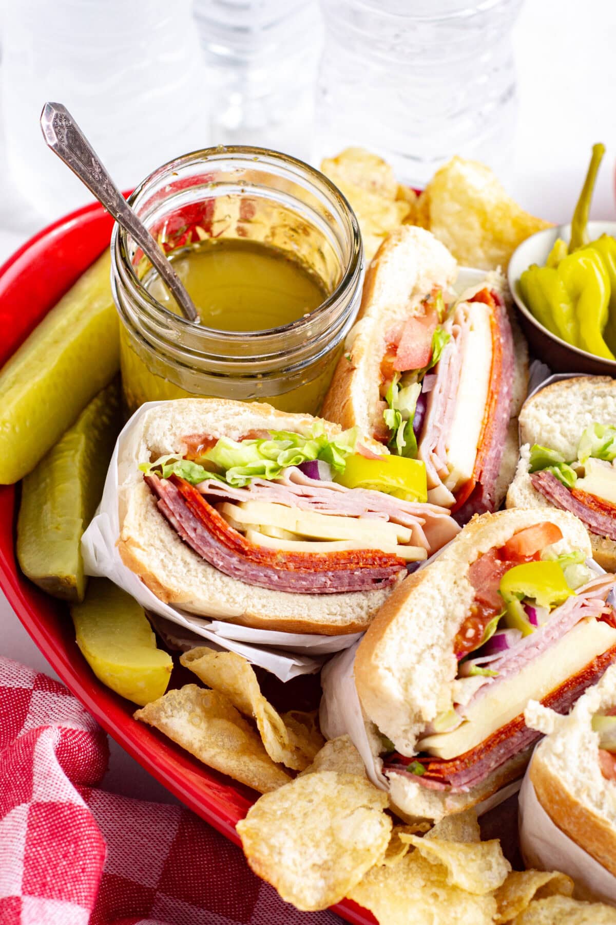 platter of italian subs with red wine vinaigrette and pickles