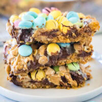 cropped close up of easter magic bars stacked on a white plate