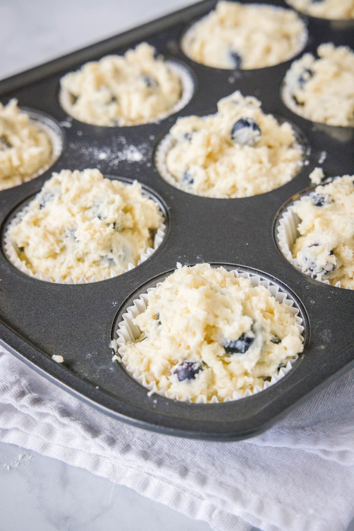 muffin batter in muffin tin ready for the oven