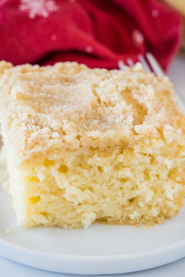 close up slice of eggnog coffee cake on a plate