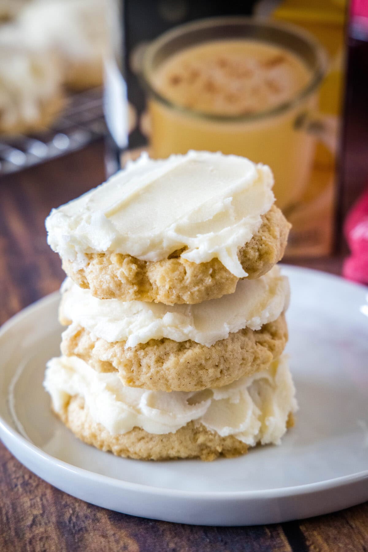 stack of eggnog sugar cookies on a white plate