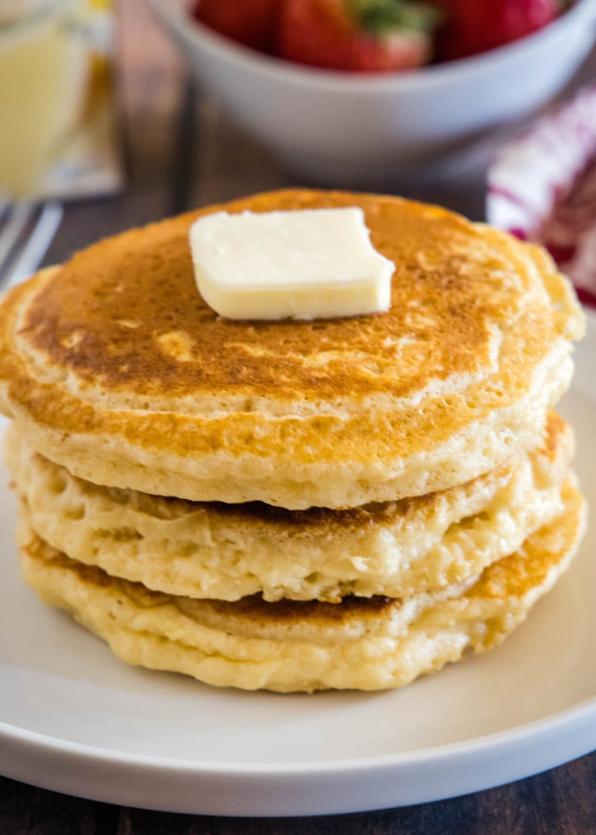 stack of eggnog pancakes on a plate