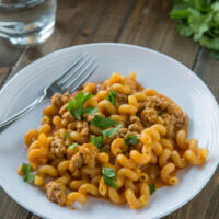 cropped image of enchilada pasta skillet on a white plate