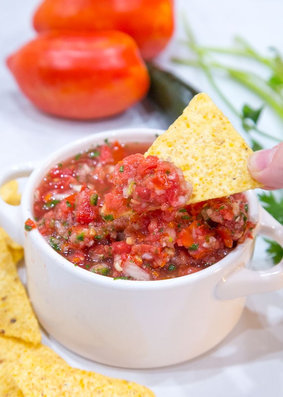 chip dipped in fresh salsa
