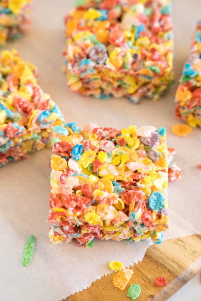 sliced fruity pebbles treats on a cutting board