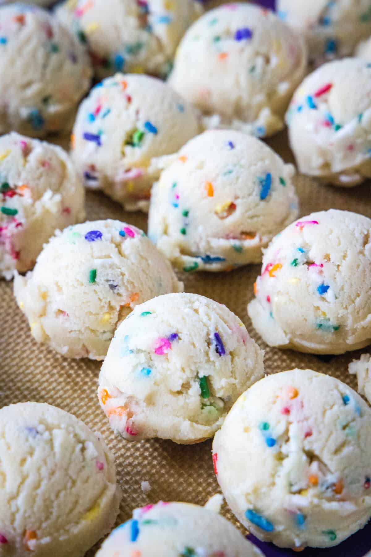balls of funfetti cookie dough on a baking sheet