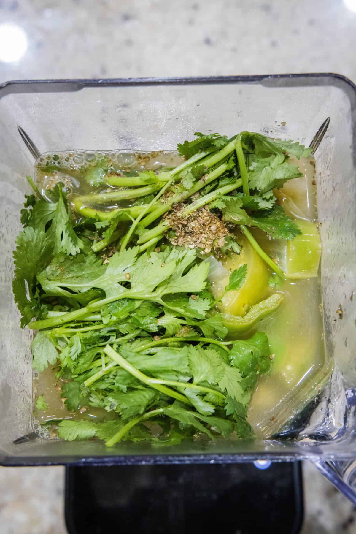 green enchilada sauce ingredients in a blender