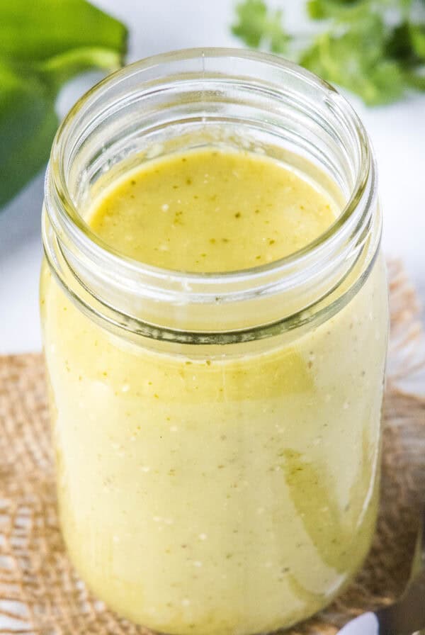close up green enchilada sauce in a jar