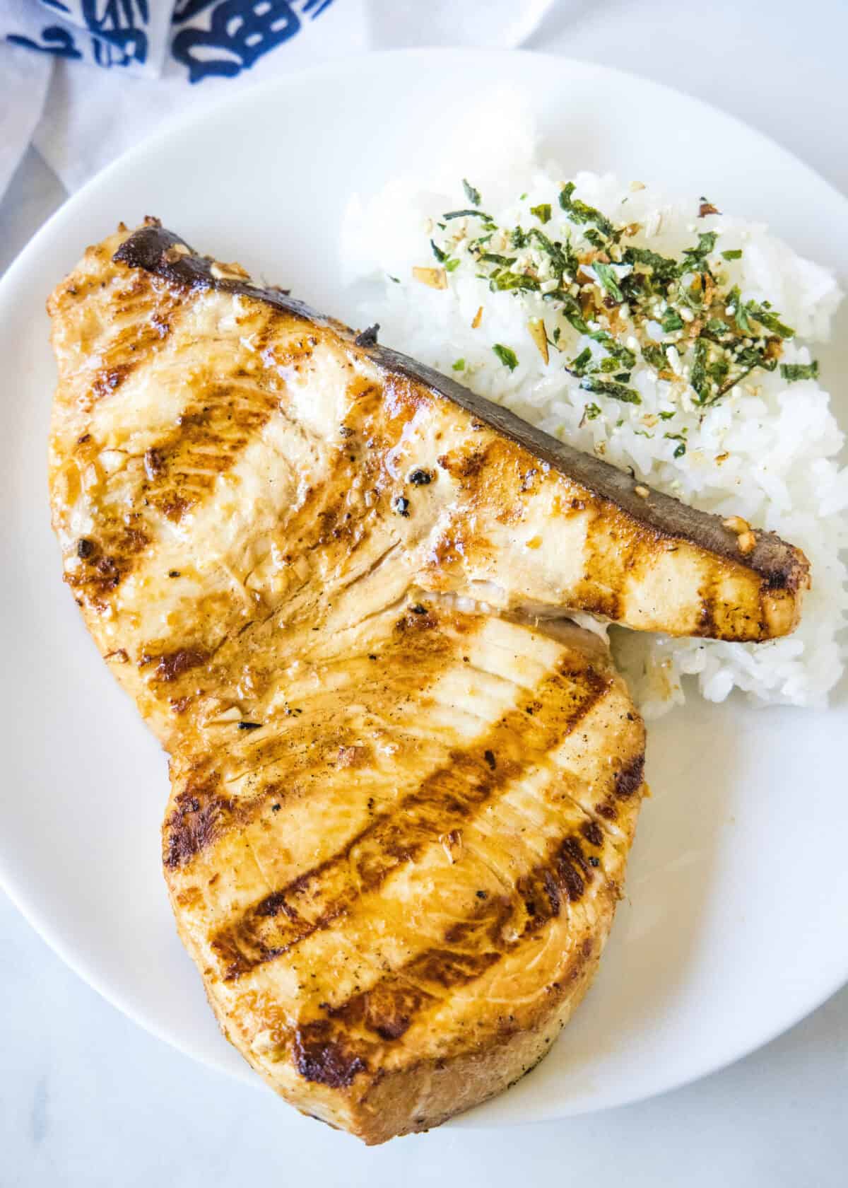 looking down on a plate with grilled swordfish and rice