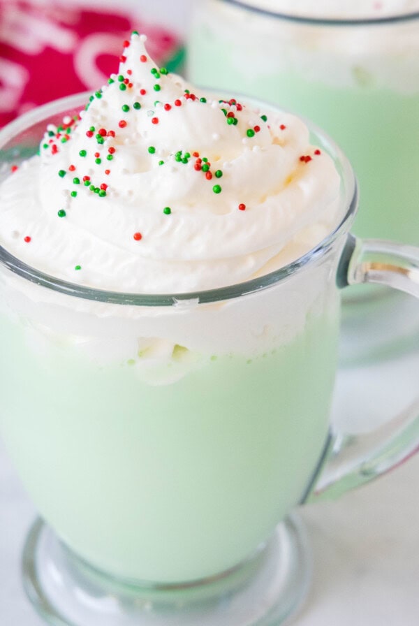 cropped close up cup of grinch hot chocolate
