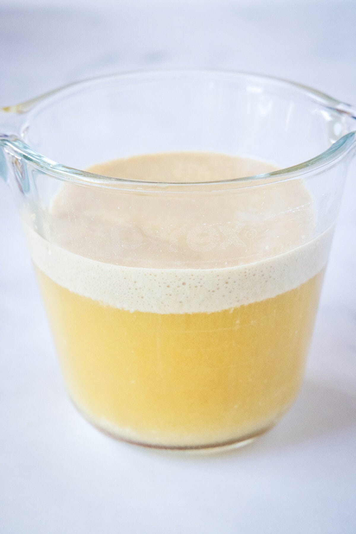 blooming yeast in measuring cup