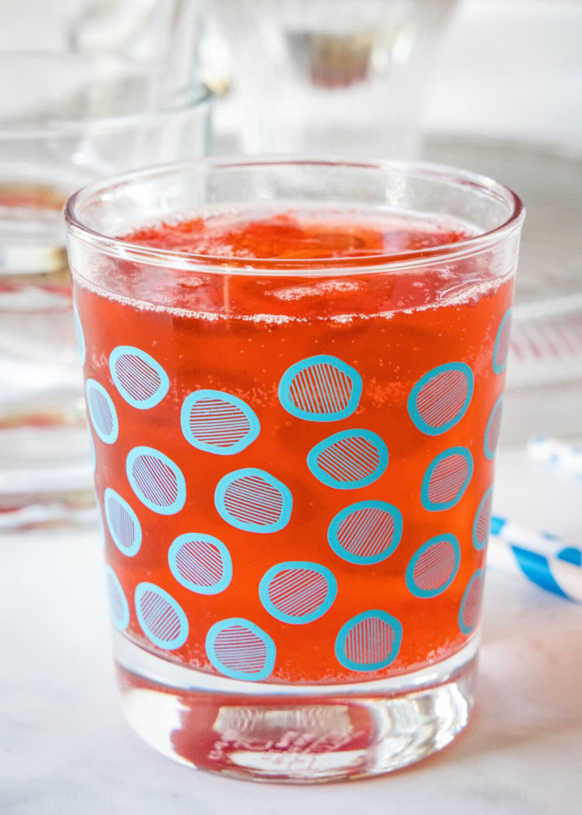 Holiday punch in a glass with a blue circle pattern.