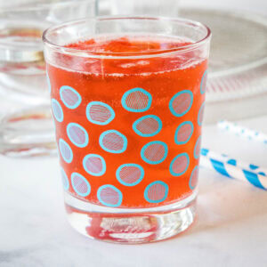 Holiday punch in a glass with a blue circle pattern.
