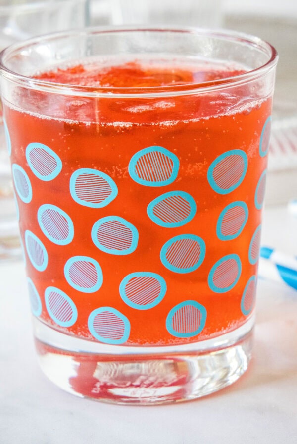 Holiday punch in a glass with a blue circle pattern.