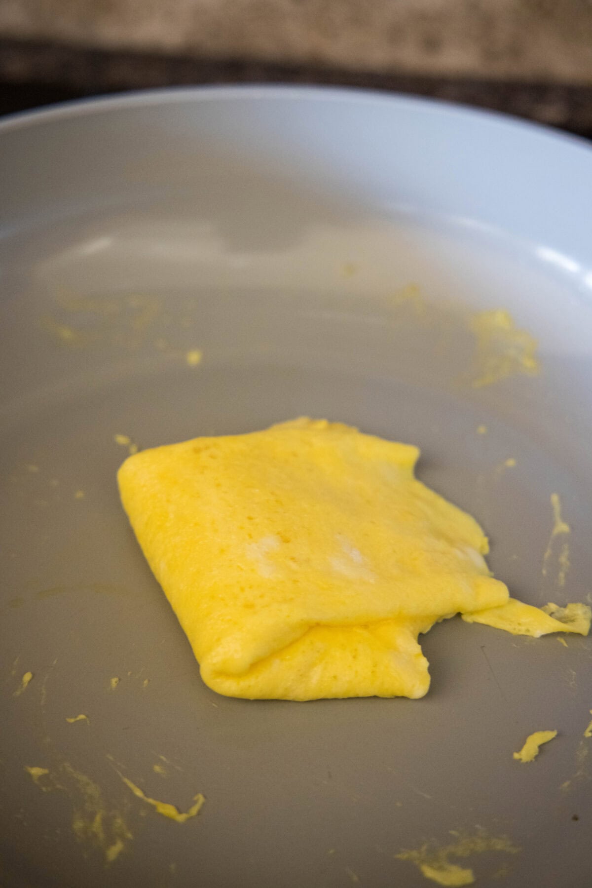 folding egg in half in skillet