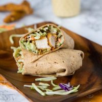 Honey Sesame Chicken Salad Wraps - Broccoli slaw coated in a creamy honey sesame dressing. Wrapped with crispy chicken for a quick and easy meal.