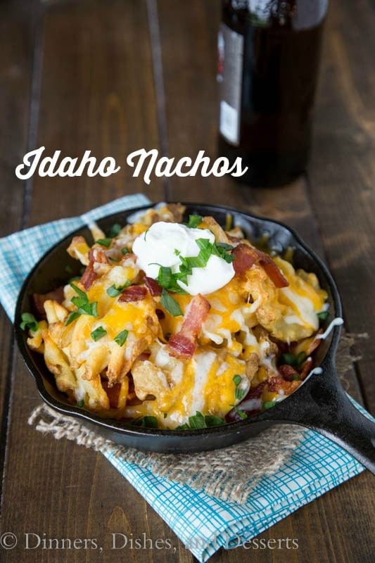 Copycat Granite City Idaho Nachos - a restaurant favorite appetizer at home! Crispy waffle fries topped with bacon, green onions and lots of melty cheese!