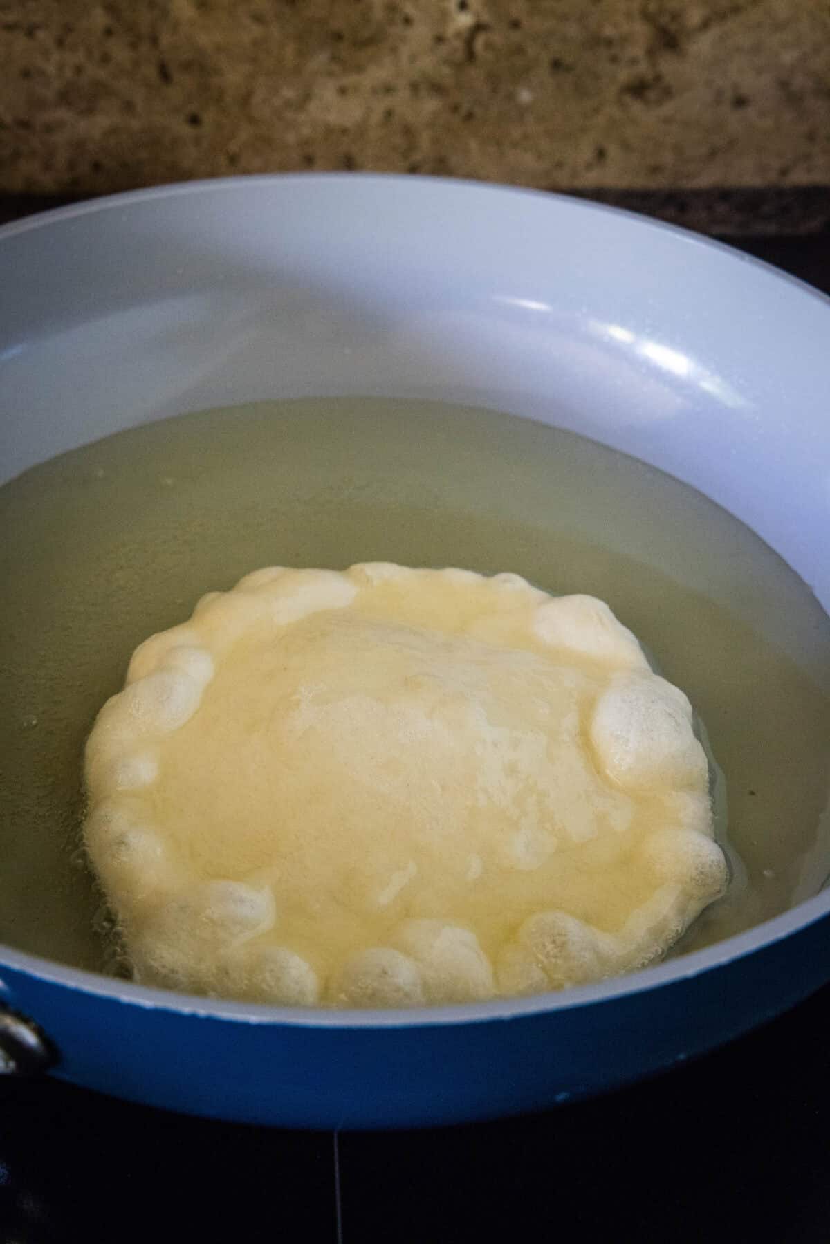 fry bread in a pan with oil