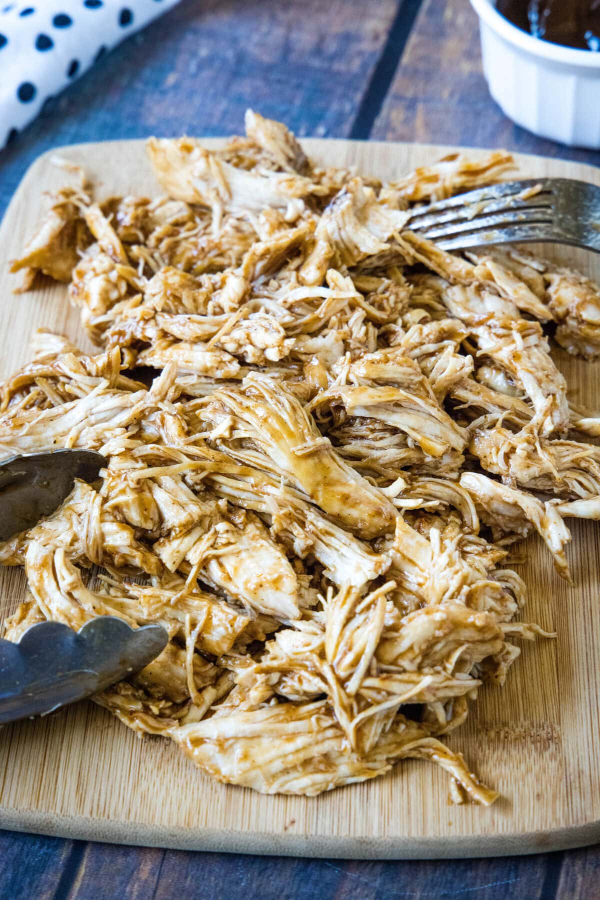 shredded chicken on a cutting board