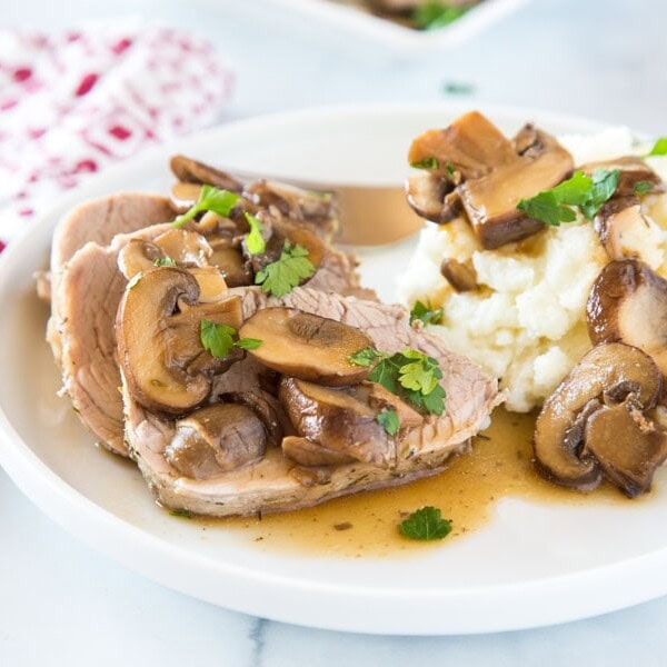 Instant Pot Pork Tenderloin - a tender and juicy pork tenderloin that is cooked in the instant pot with an easy mushroom sauce! 