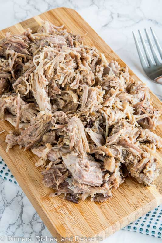Food on a wooden table, with Pork and Pulled pork
