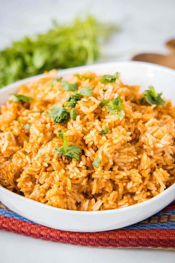 mexican rice in a bowl topped with cilantro