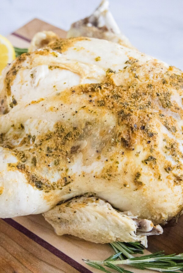 cropped close up instant pot whole chicken on a cutting board
