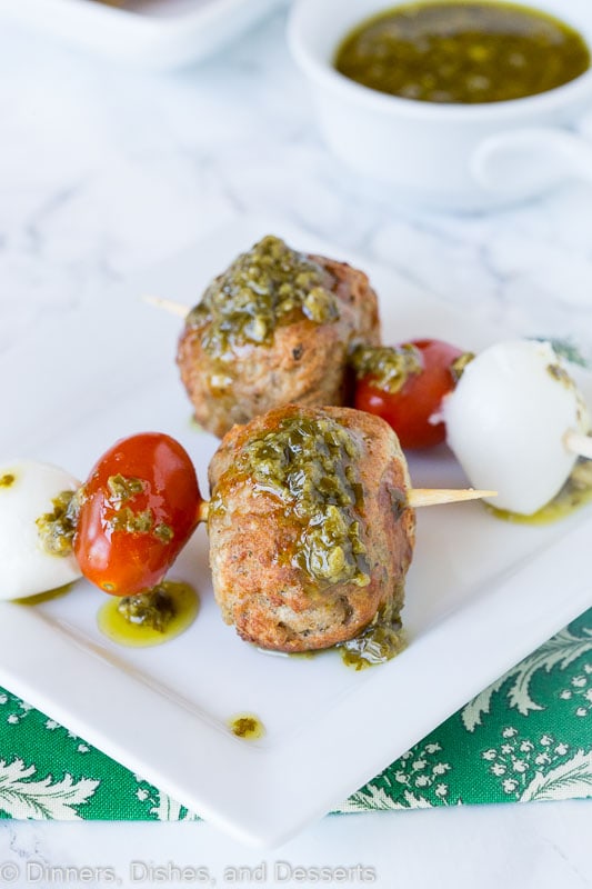 meatball skewer with mozzarella cheese, tomato, meatball and pesto