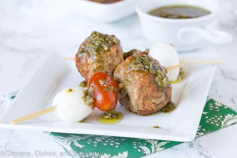 meatball skewer with mozzarella cheese, tomato, meatball and pesto