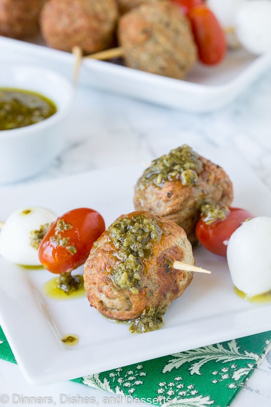 meatball skewer with mozzarella cheese, tomato, meatball and pesto