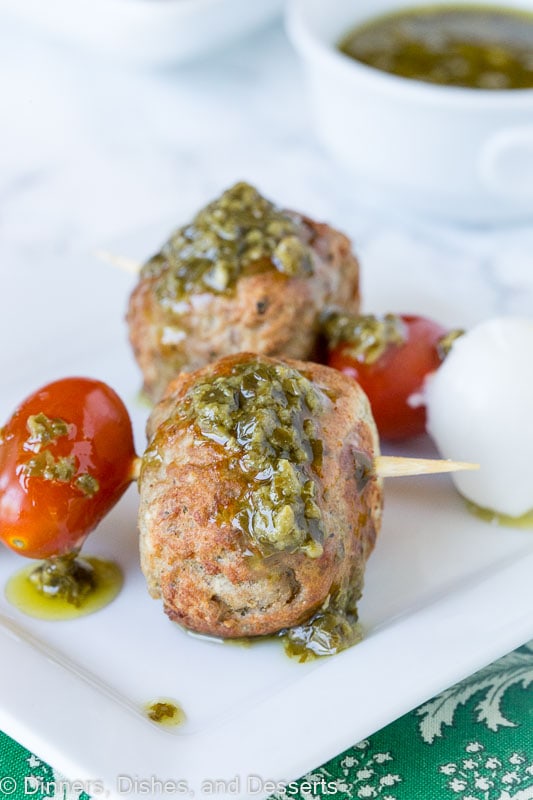 meatball skewer with mozzarella cheese, tomato, meatball and pesto