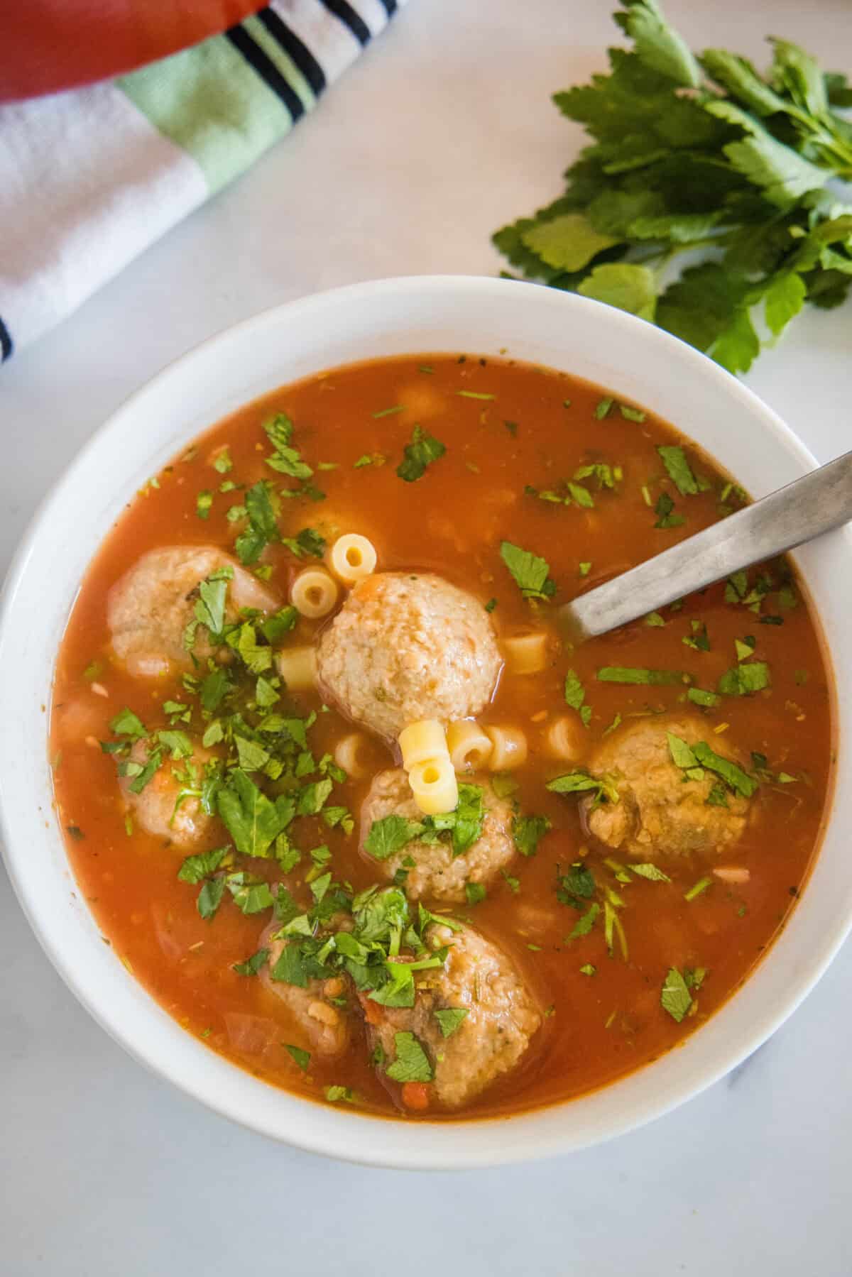 looking down on bowl of italian meatball soup