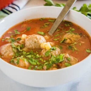 close up italian meatball soup in a bowl