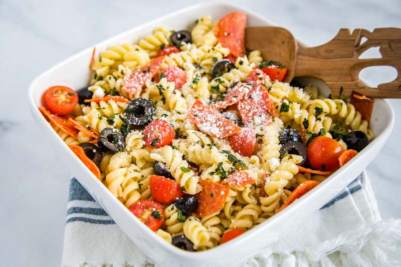 Italian Pasta Salad - a great cold pasta salad recipe that is perfect all summer long!  It is full of pepperoni, fresh tomatoes, black olives and tossed in a zesty Italian vinaigrette.