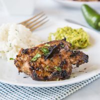 A plate of food with rice meat and vegetables