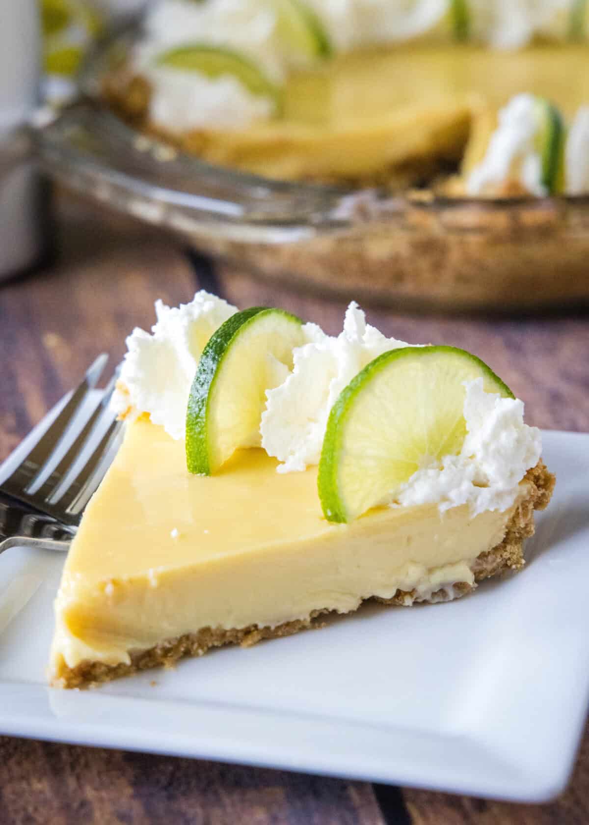 slice of key lime pie on a white plate