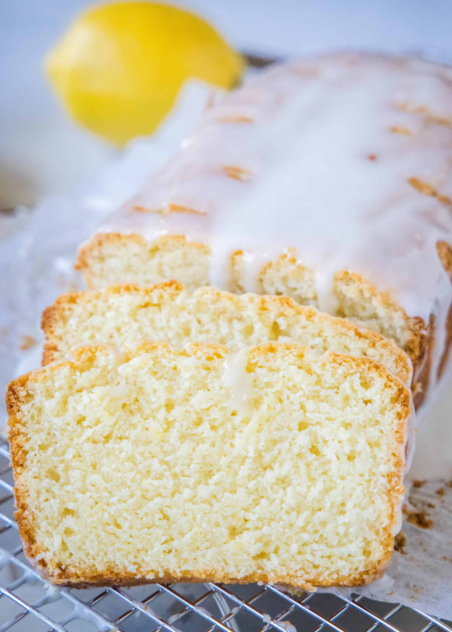 Glazed lemon loaf with two slices cut from the end.