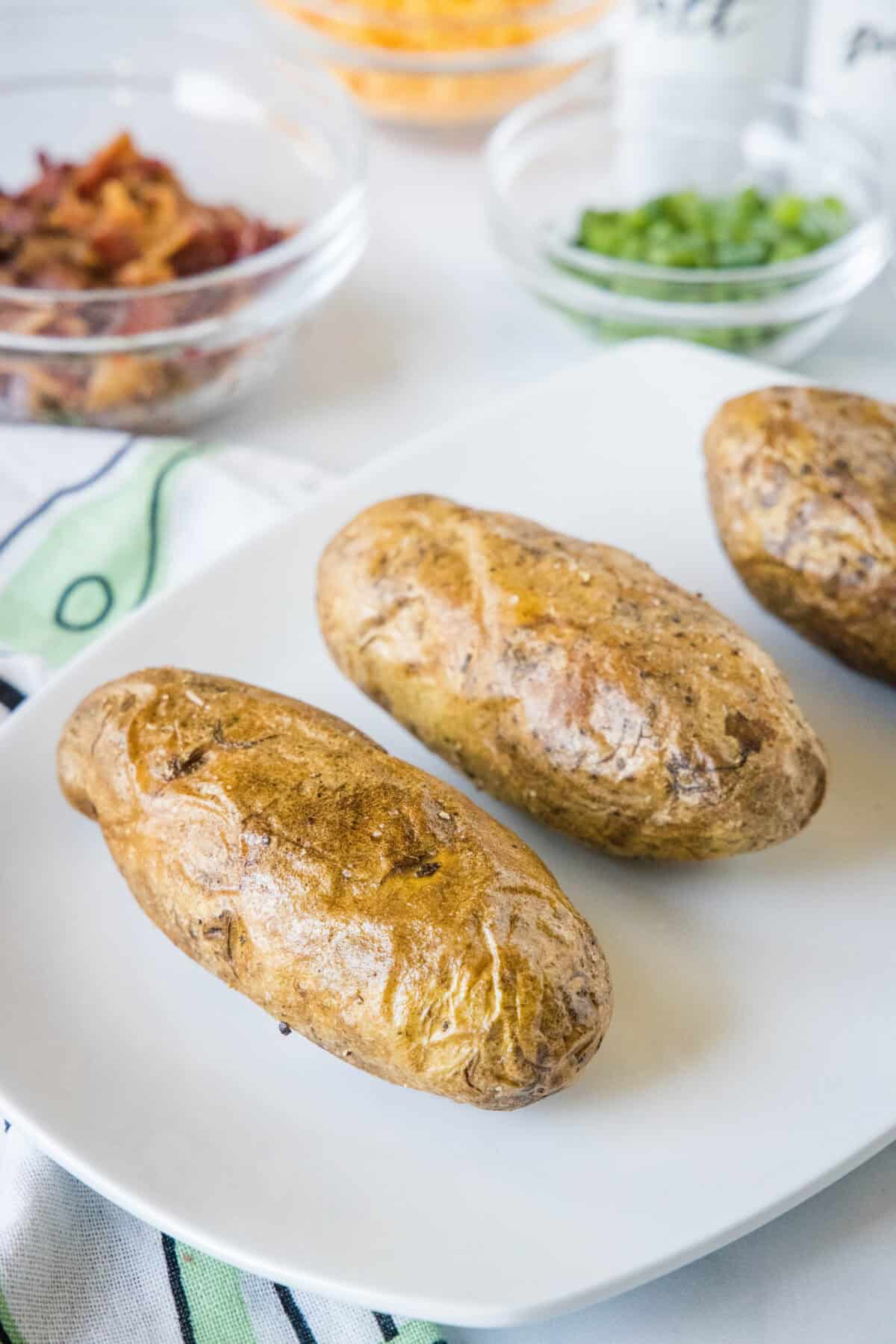 baked potatoes on a serving platter