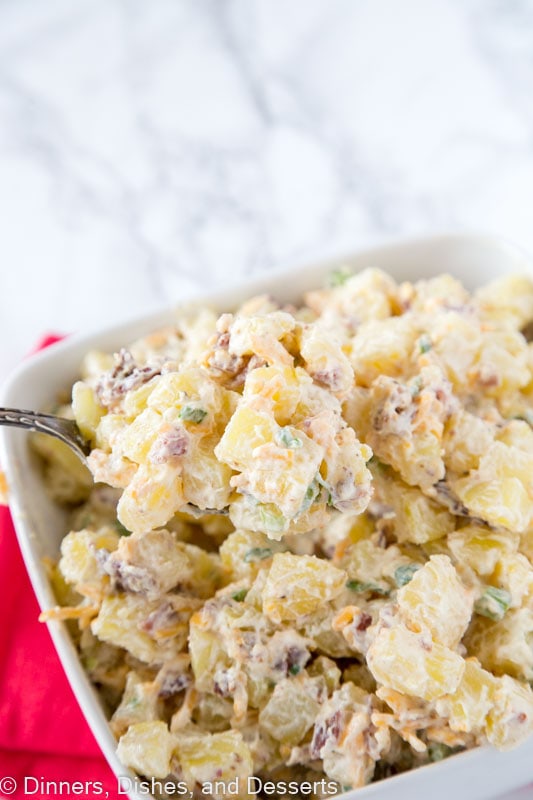 A close up of a plate of food  with Salad and Potato salad